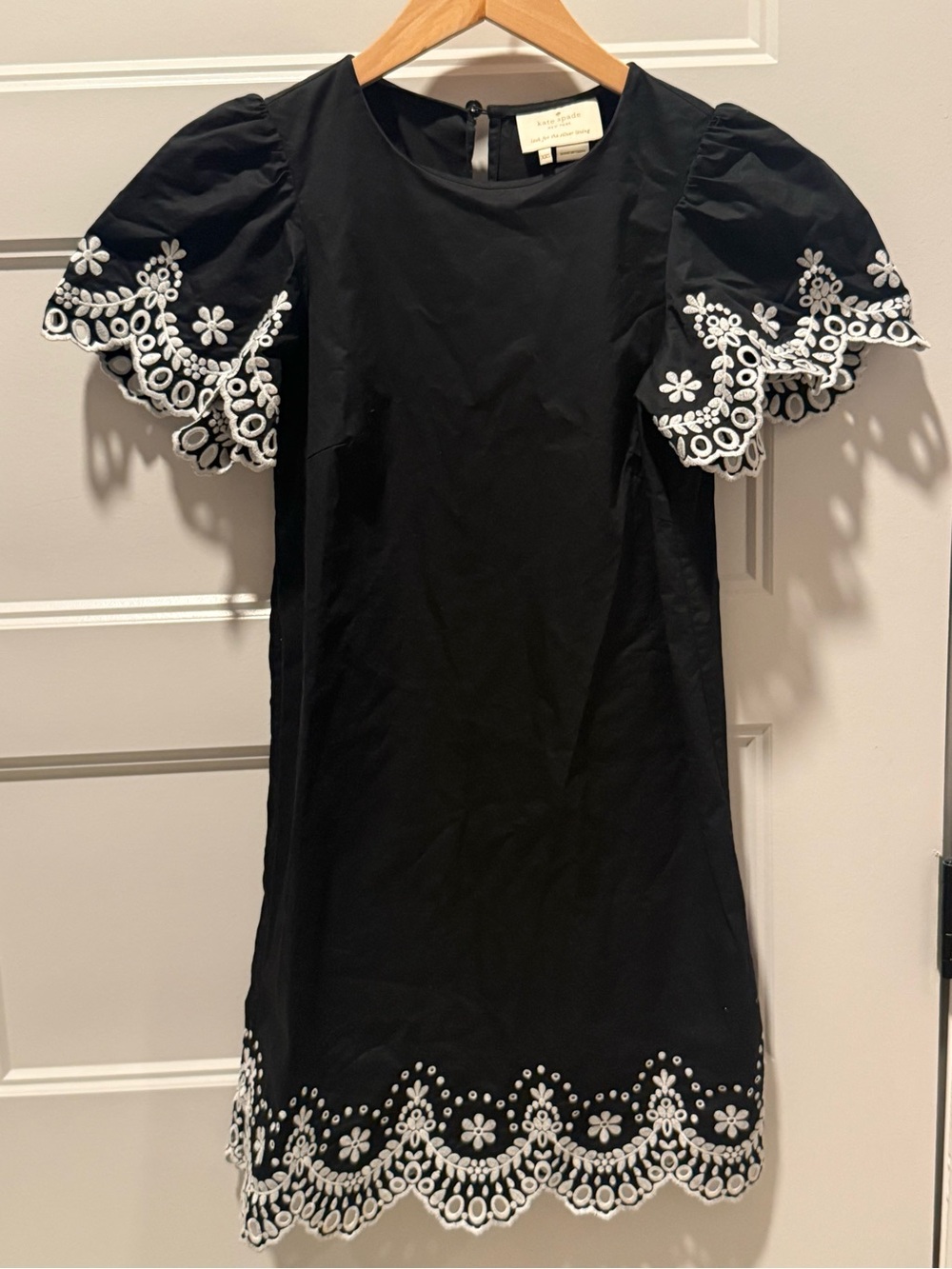kate spade cream and black logo label